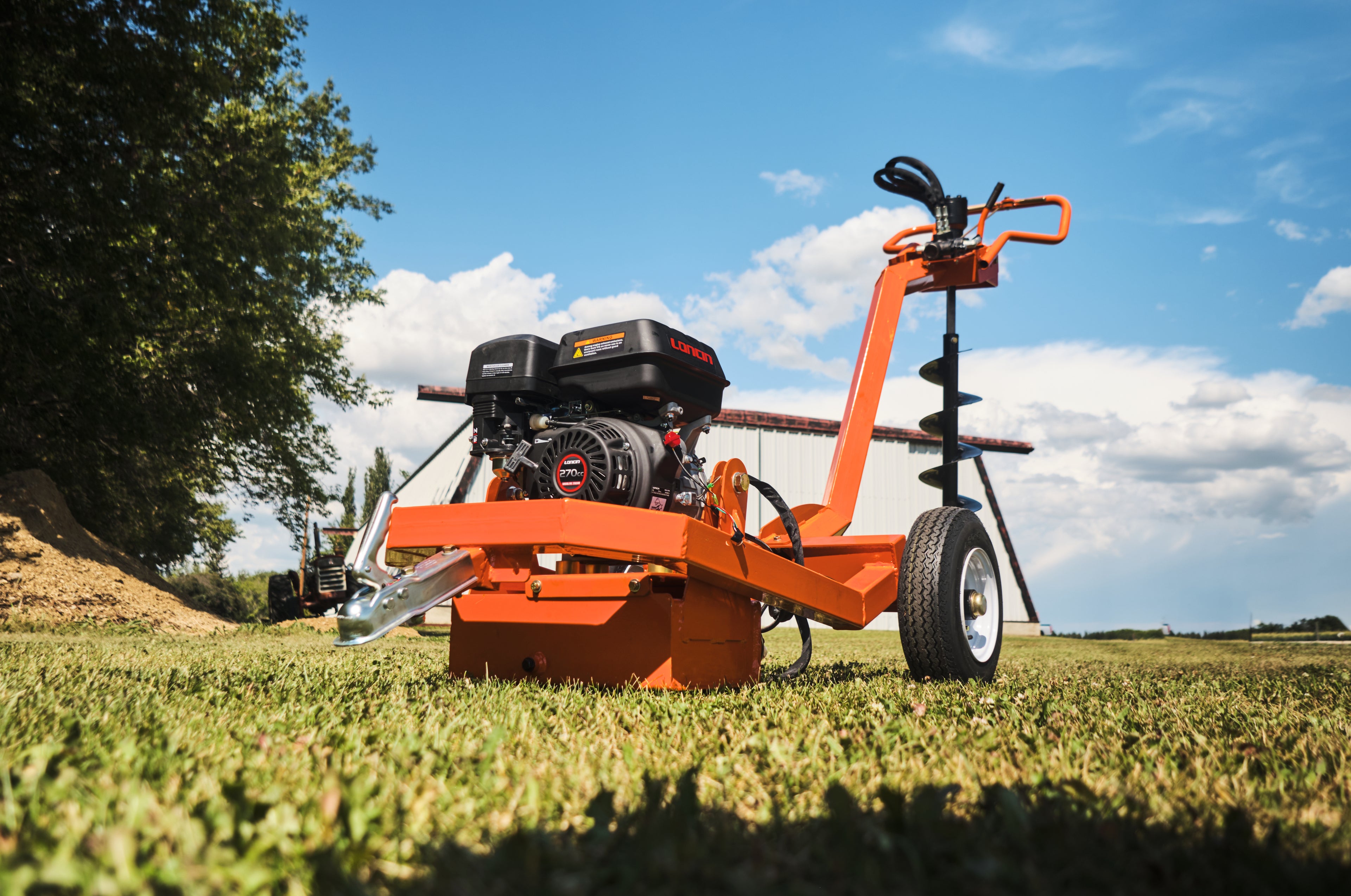 REX Equipment Post Hole Digger in a Canadian Farm Field